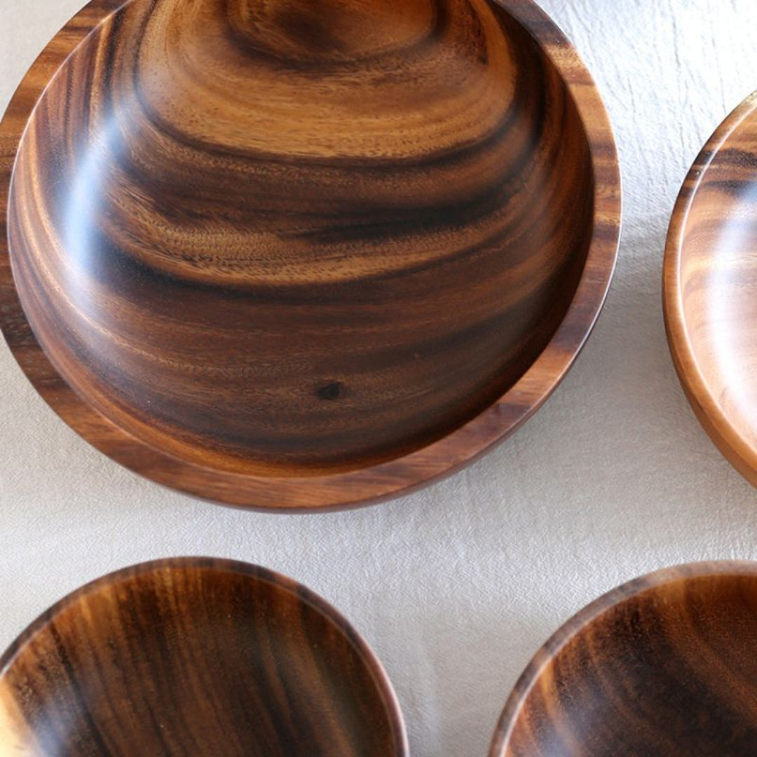 Set of wooden bowls with a focus on texture and grain.