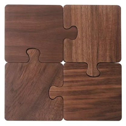 Four wooden puzzle pieces arranged in a square formation on a white background.