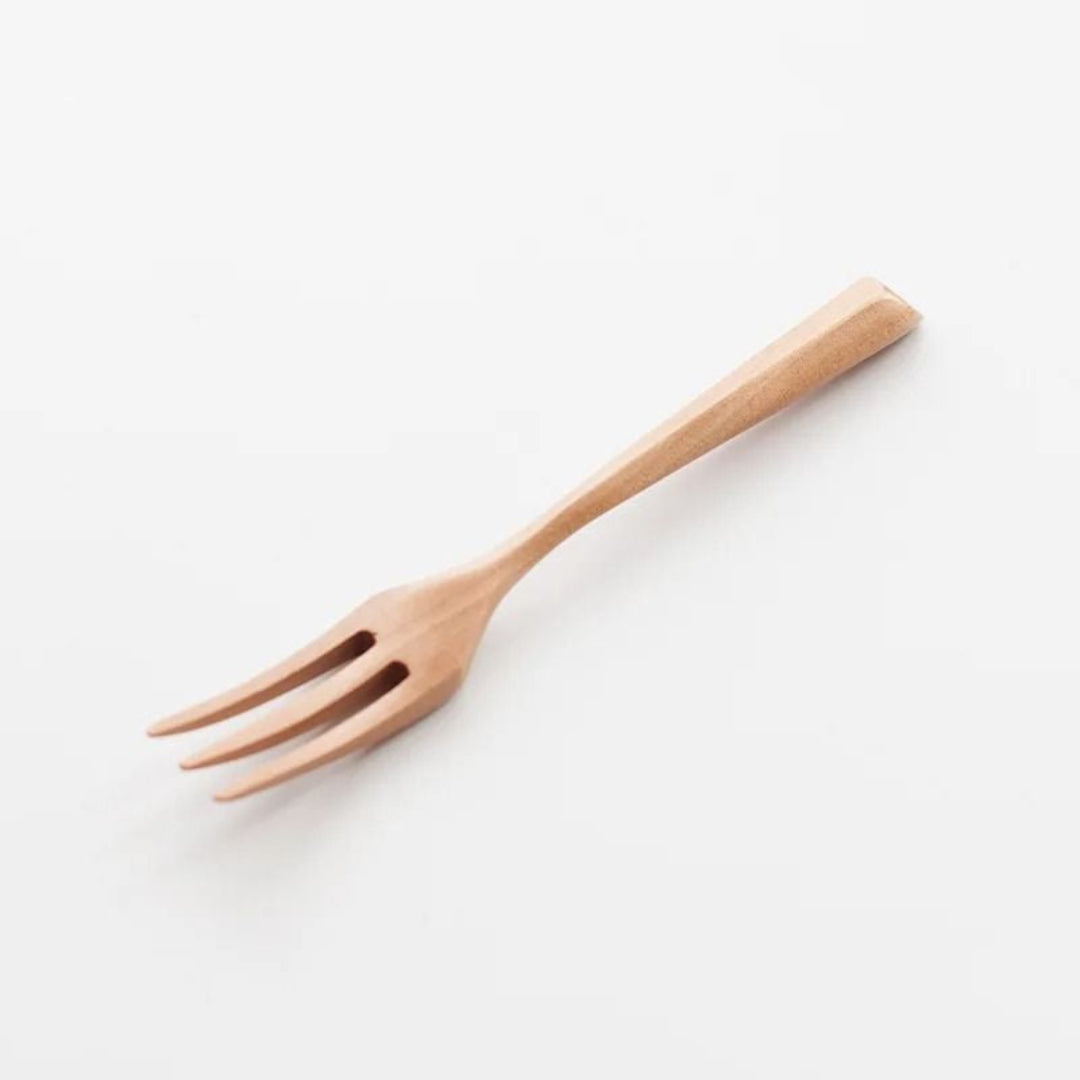 Wooden fork on a white background