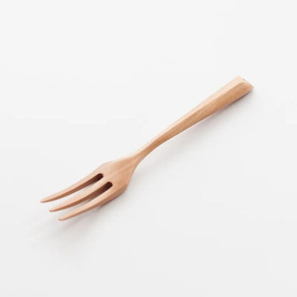 Wooden fork on a white background