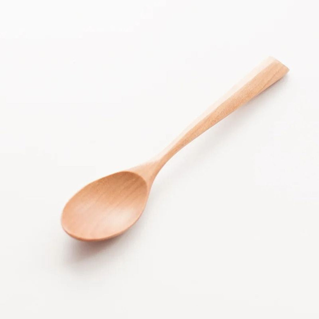 Wooden spoon on a white background