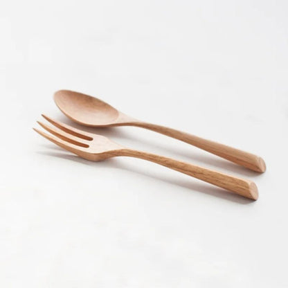 Wooden spoon and fork set on a white background