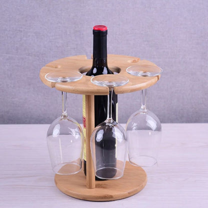Wooden wine rack with a bottle and glasses on a gray background