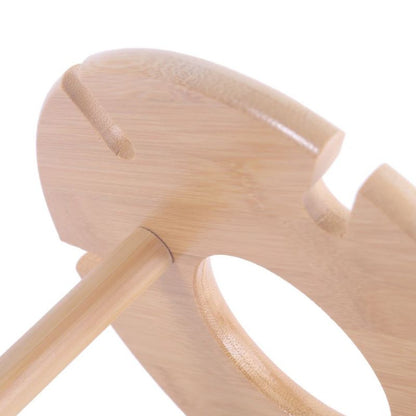 Close-up of a wooden baby rattle on a white background