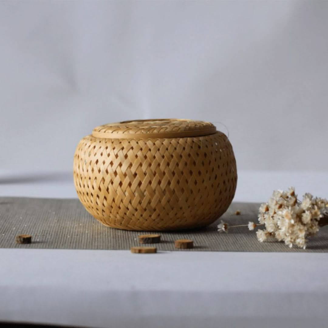 Woven bamboo container on a table with a minimal background