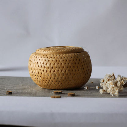 Woven bamboo container on a table with a minimal background