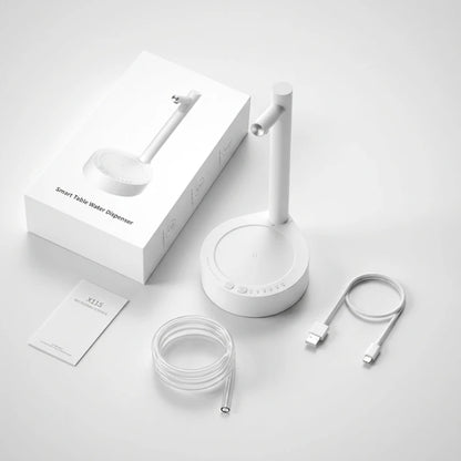 Josh & Tate - TapFlow™ Desktop Water Dispenser - White smart table water dispenser with packaging, cable, and accessories on a light gray background