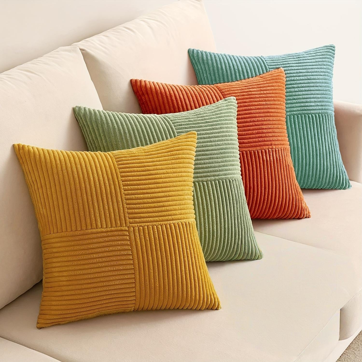 Colorful textured pillows on a beige sofa